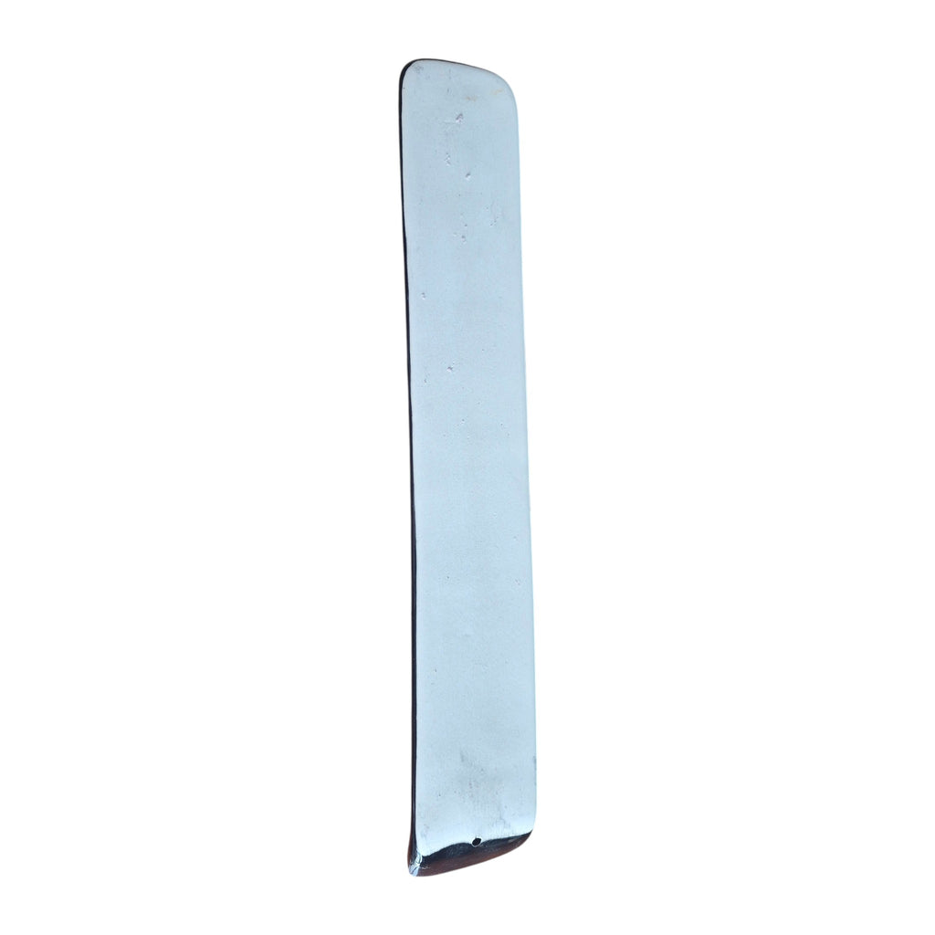 Side view of rainbow chakra ceramic incense holder showing curved tray and incense stick hole