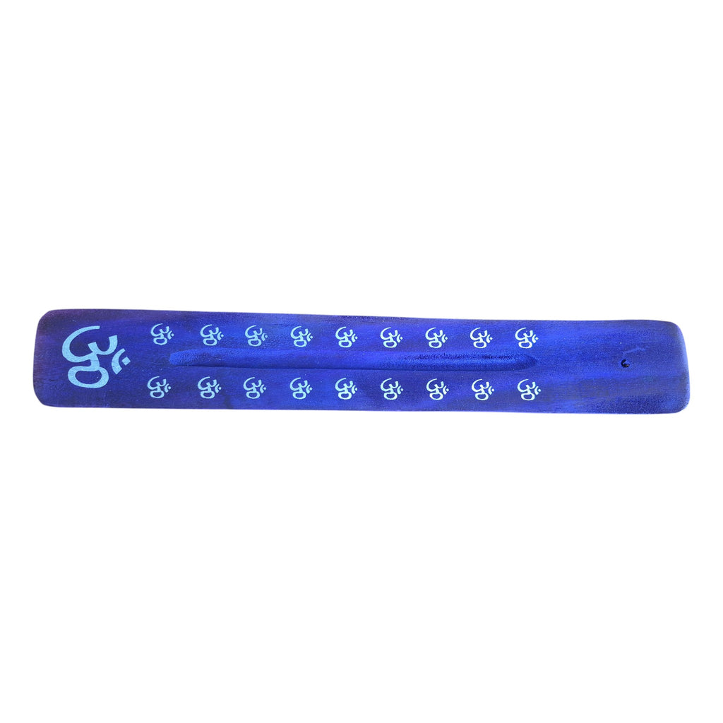 Orange wooden incense holder with blue yin-yang motifs, top view