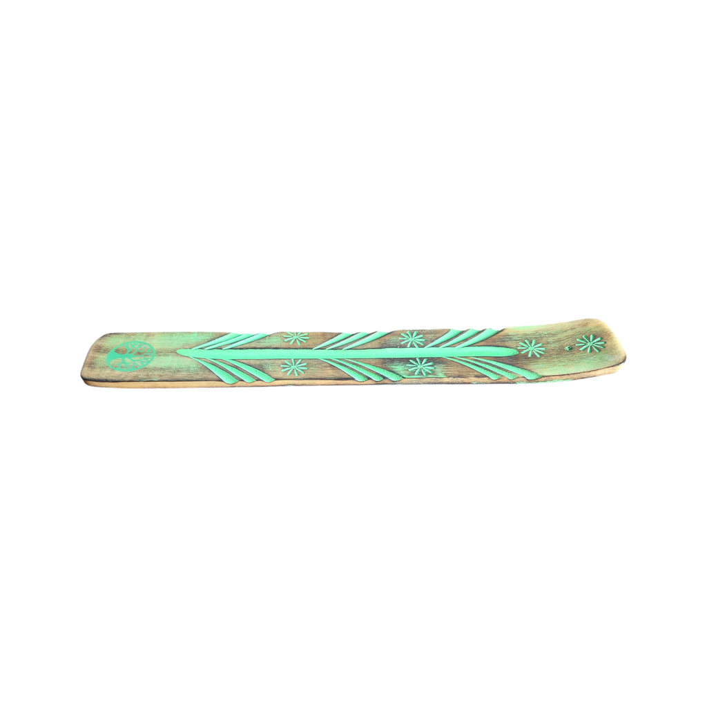Handmade wood incense holder showing turquoise-coloured detailing and central groove