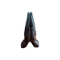 Dark polished praying hands incense stick holder viewed from the front at an angle
