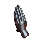 Back view of dark polished praying hands incense stick holder