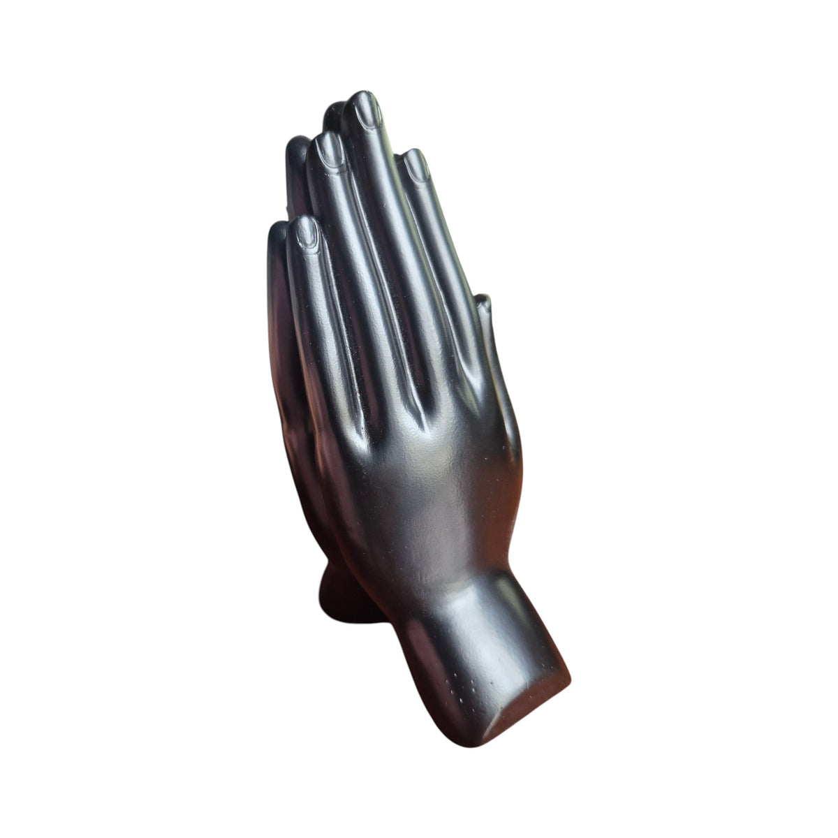 Back view of dark polished praying hands incense stick holder