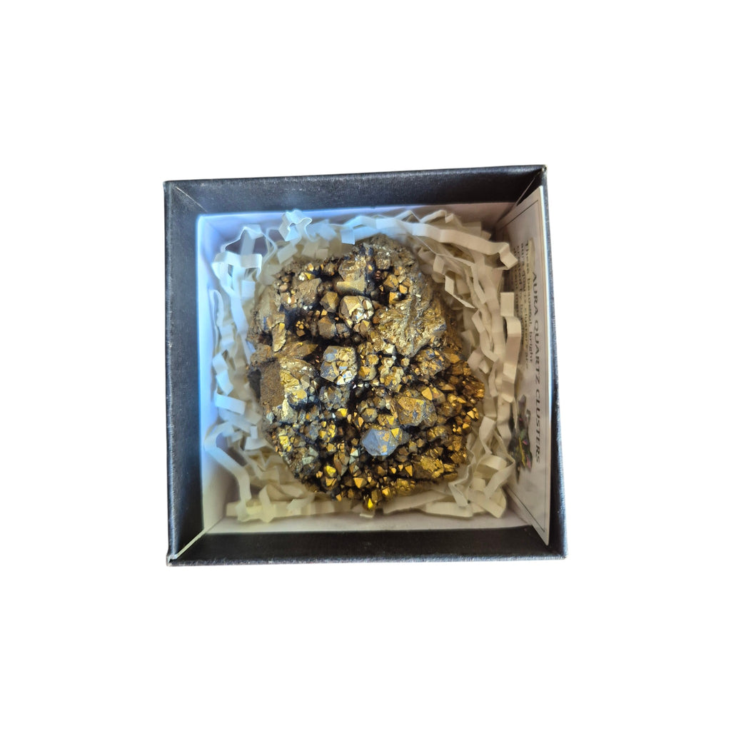 Example pale aura quartz geode with crystal cavities in a presentation box