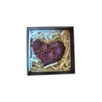 Example white shimmering aura quartz geode in a presentation box