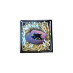 Example vivid blue aura quartz geode in a presentation box