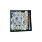 Example purple and dark iridescent aura quartz geode in a presentation box