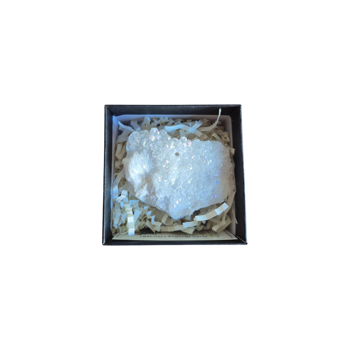 Example silver-toned geode with dark crystal cavity in a presentation box
