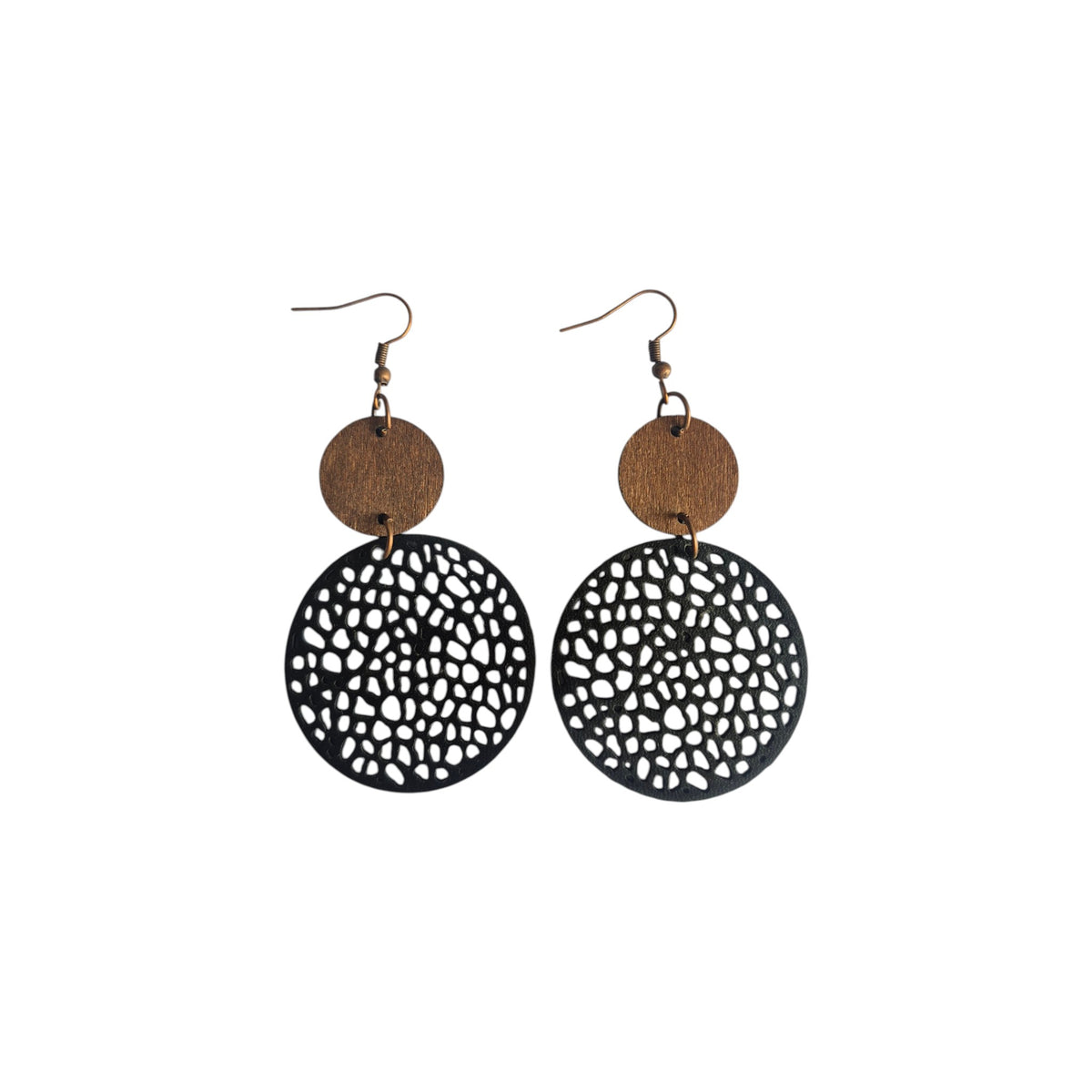 Double disc earrings with small brown discs above larger black circles with irregular cut-outs and bronze-tone hook ear wires on white