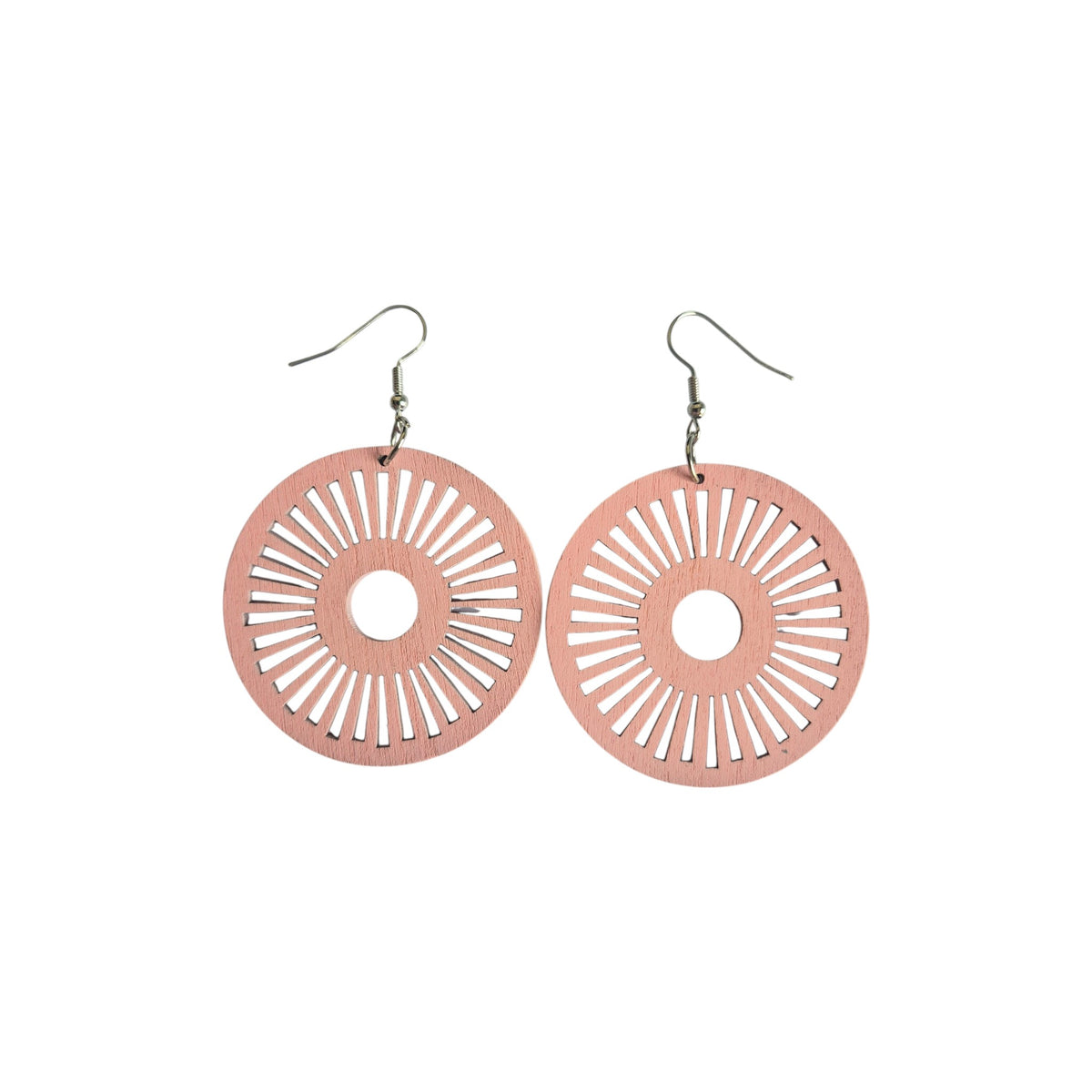 Pair of pink round wooden earrings with open circular centres, radiating sunburst cut-outs and silver-tone hook ear wires on a white background