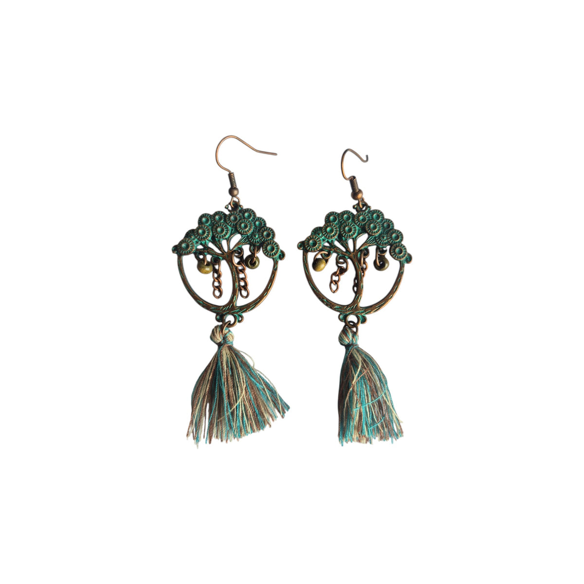 Pair of bronze-tone tree of life earrings with green accents, small dangling details and green and brown tassels on a white background