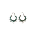 Pair of bronze-tone metal hoop earrings with green-accented scrollwork and pointed sunburst-style borders on a white background