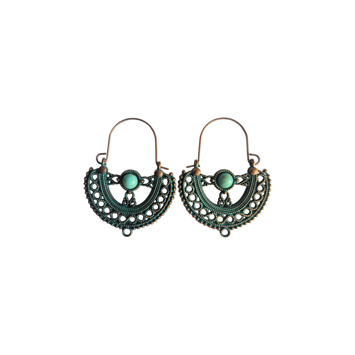 Pair of bronze-tone half-moon metal hoop earrings with ornate openwork, green accents, round green centrepieces and arched ear wires on white