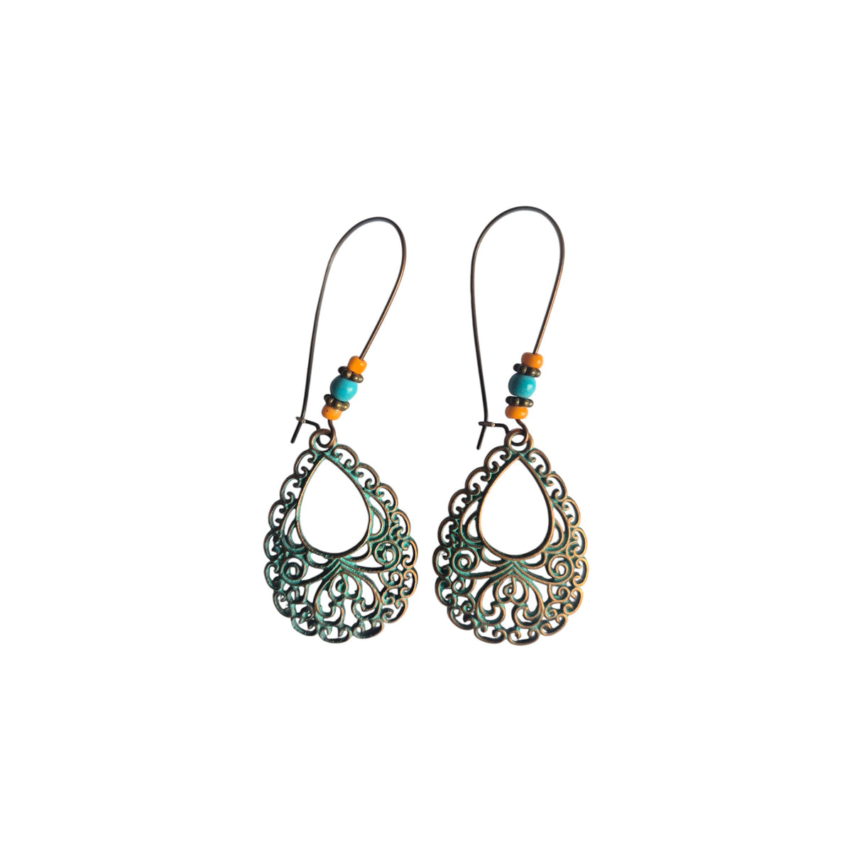 Pair of bronze-tone teardrop filigree metal earrings with green accents, turquoise-coloured and orange beads, and long loop-style ear wires on white