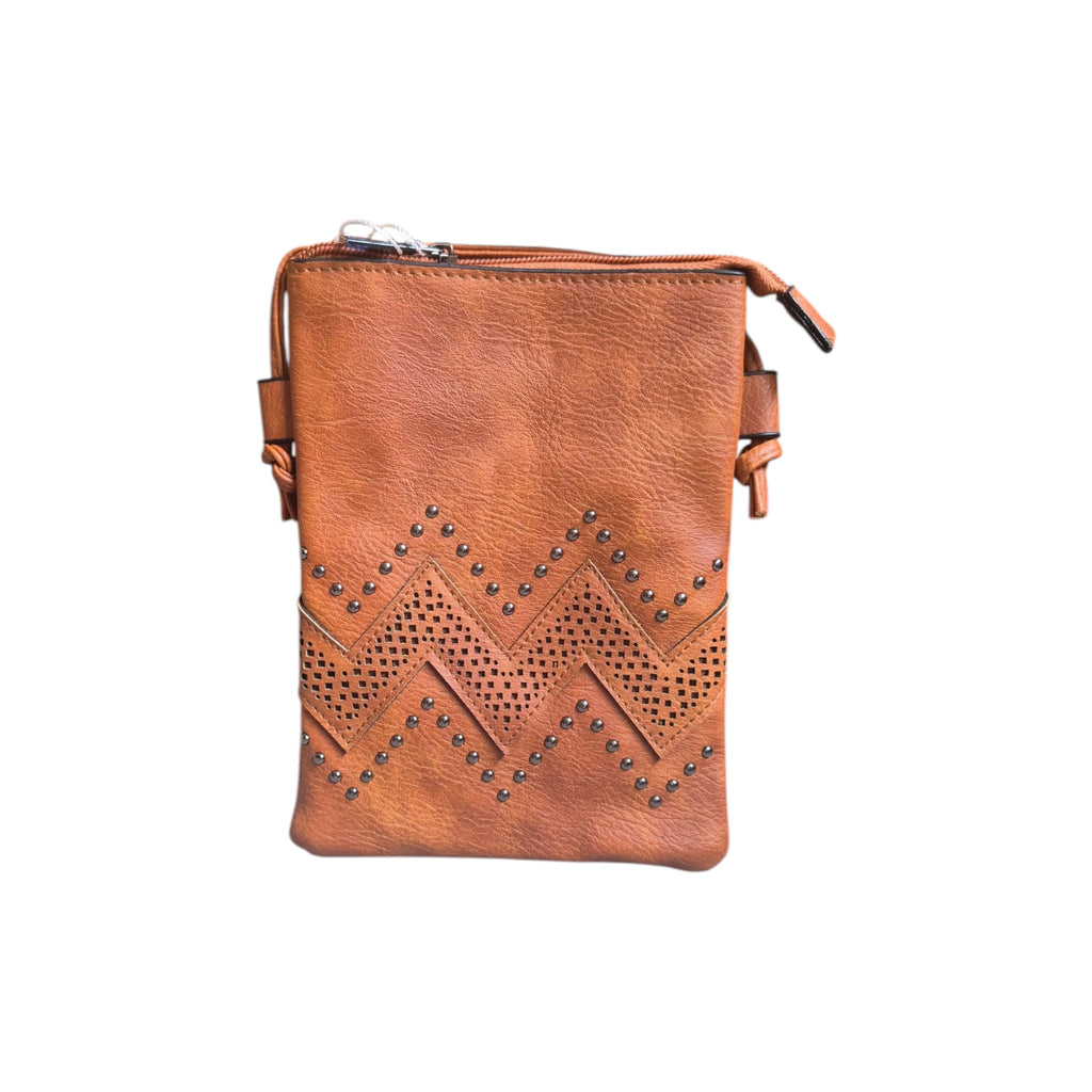 Chevron stud laser cut crossbody handbag by Loren Boyd, featuring geometric pattern and adjustable strap for versatile style. nz