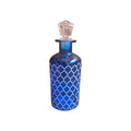 Blue glass bottle with white Moroccan lattice design and crystal stopper