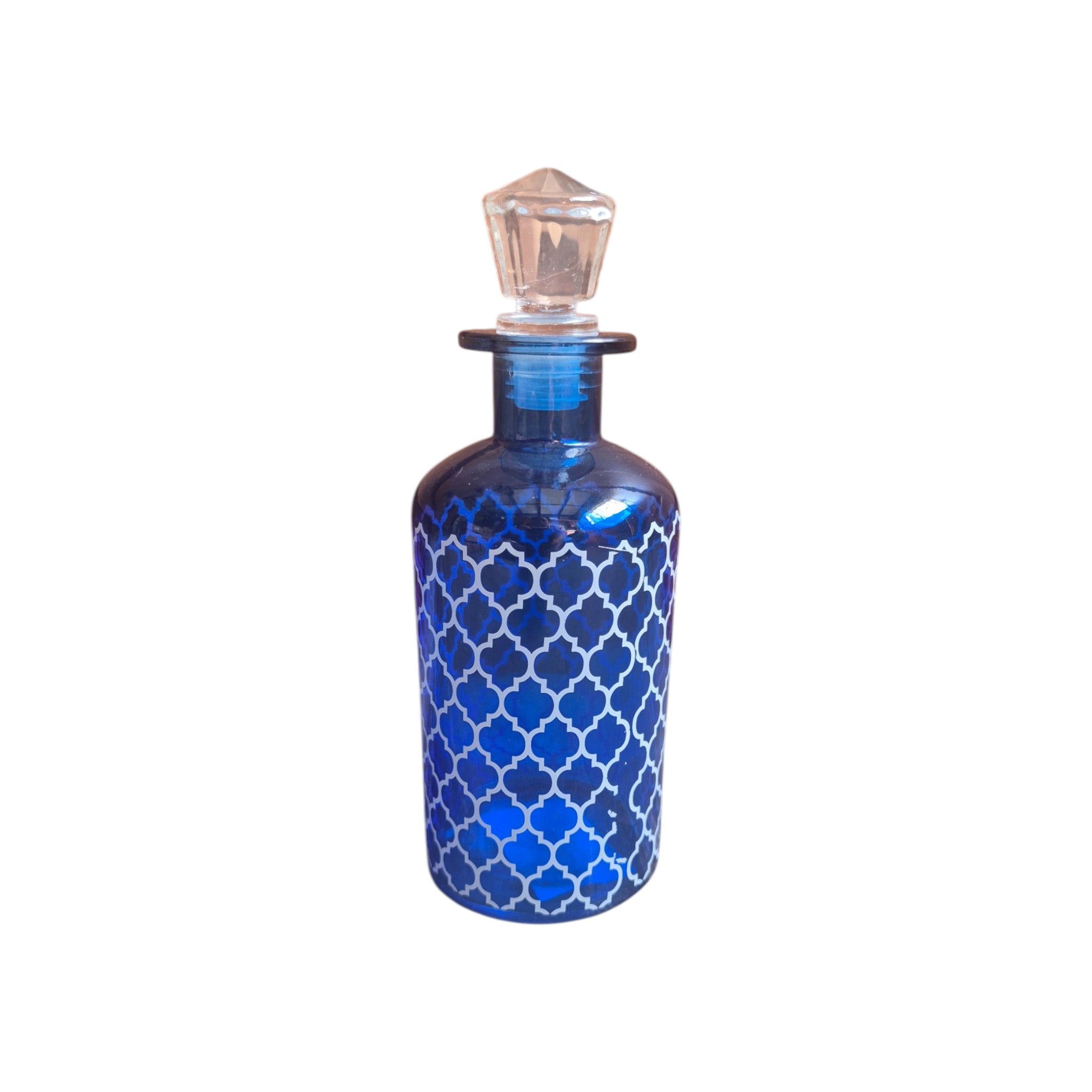 Blue glass bottle with white Moroccan lattice design and crystal stopper