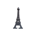 Loren Boyd Eiffel Tower cast iron bottle opener mounted on wall for opening bottles with decorative Eiffel Tower design.