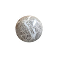 White ceramic decorative ball with striped pattern by Loren Boyd, ideal for modern home decor or tabletop display. nz