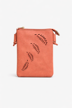 Faux leather crossbody handbag by Loren Boyd with laser-cut fern detail and adjustable strap. nz